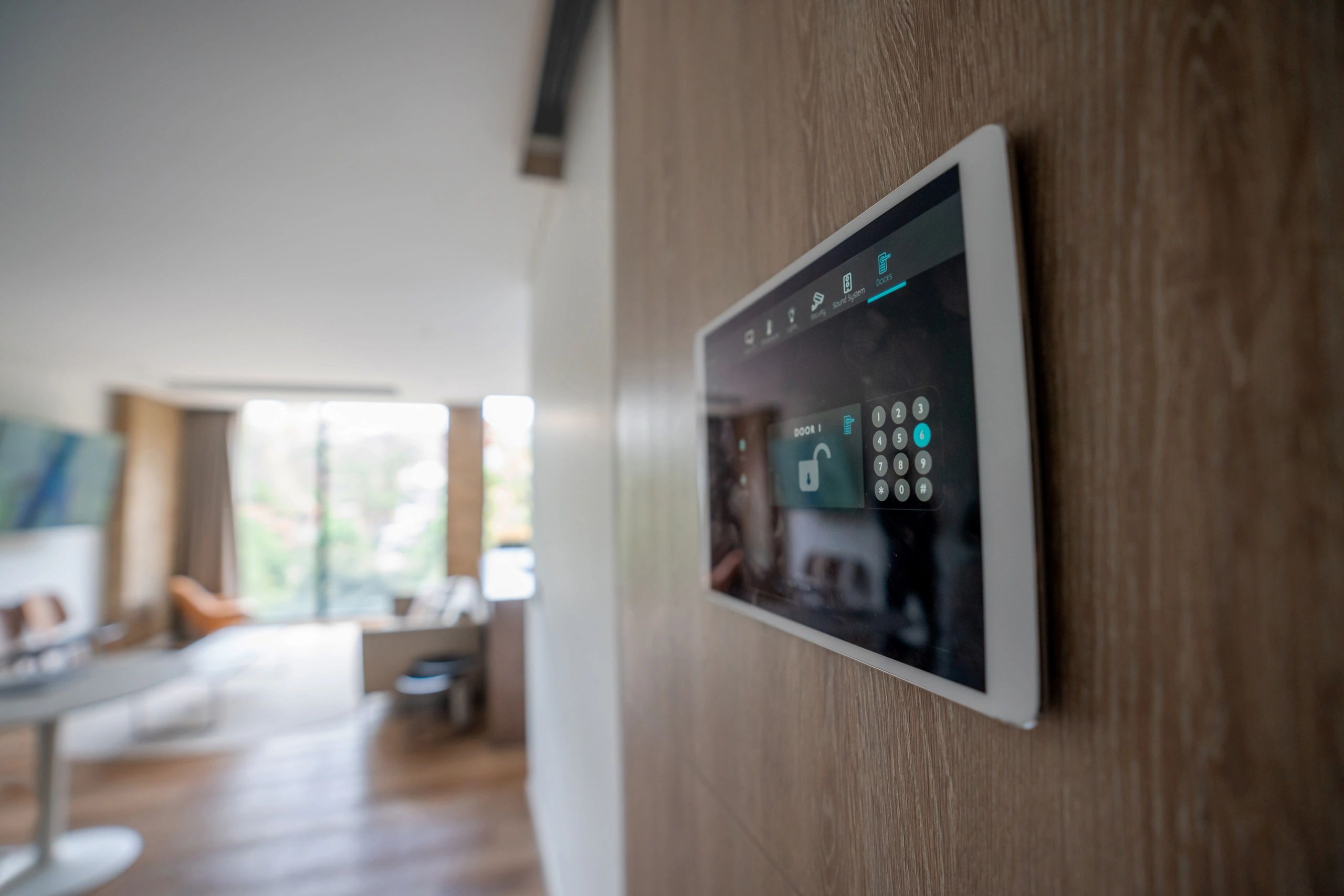 Close-up of a smart home security keypad on a front door