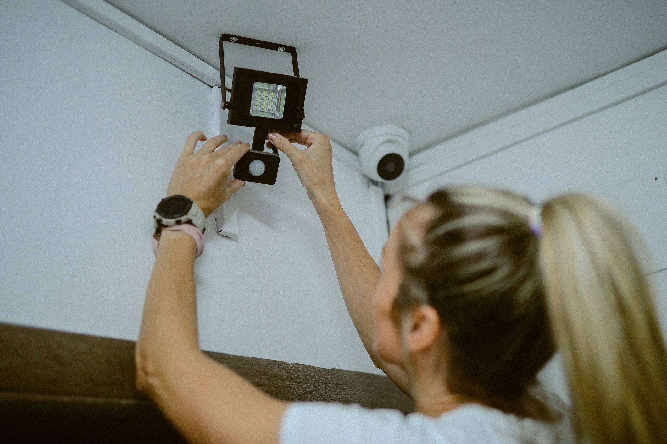 Homeowner reviewing a surveillance camera system