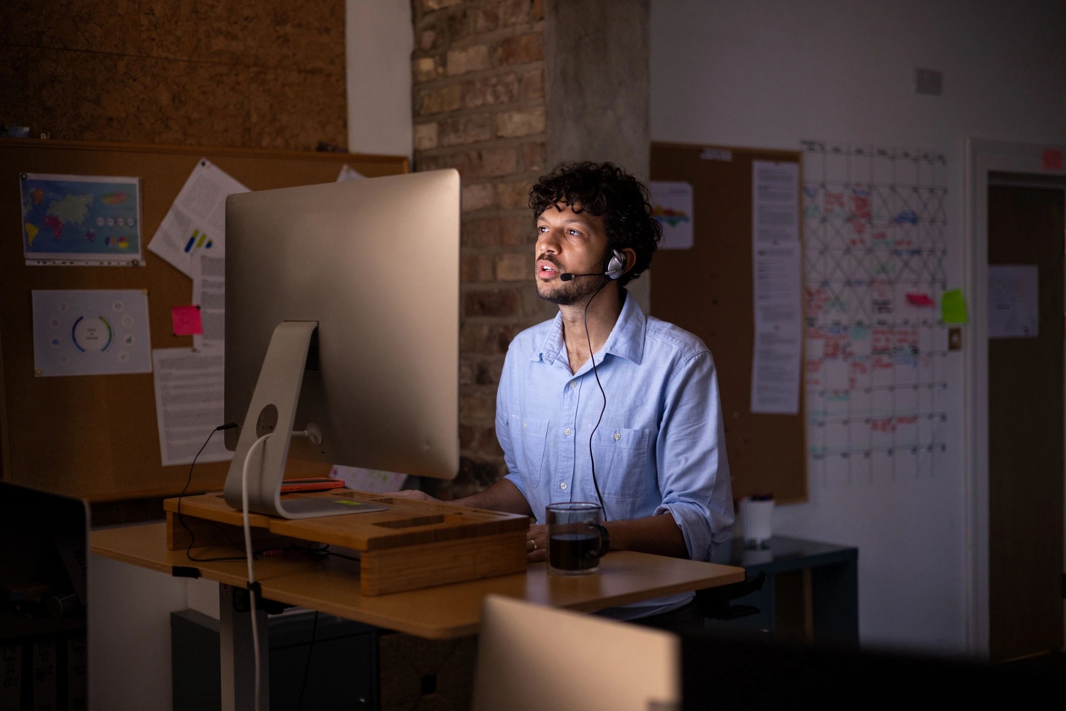 Professional working late at a standing desk